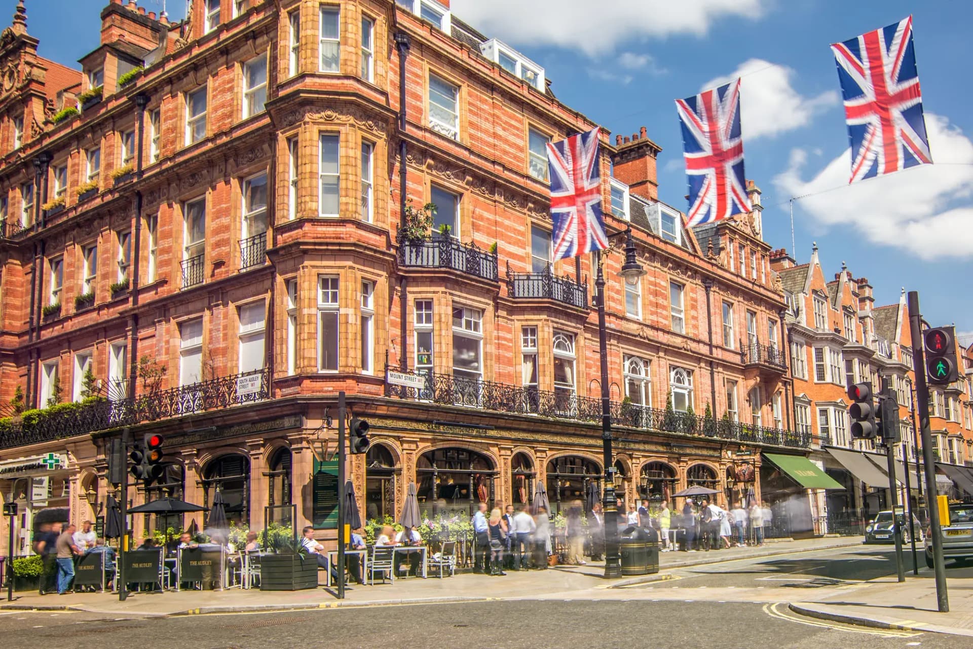 A red-brick corner of Mayfair on a summer afternoon